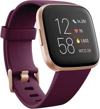 The watch with a square digital display and a purple band 