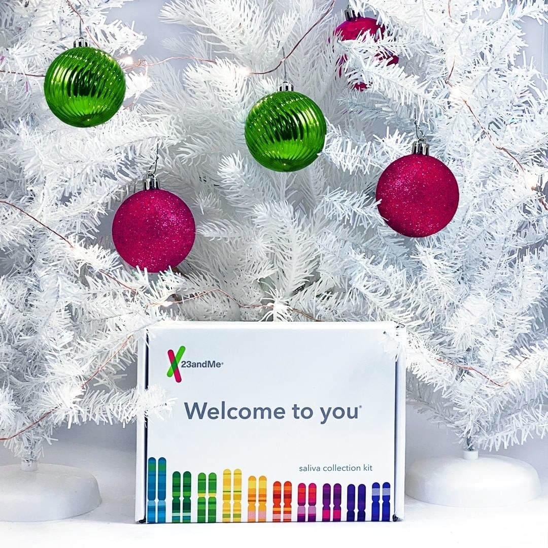 A DNA kit in a box underneath a Christmas tree