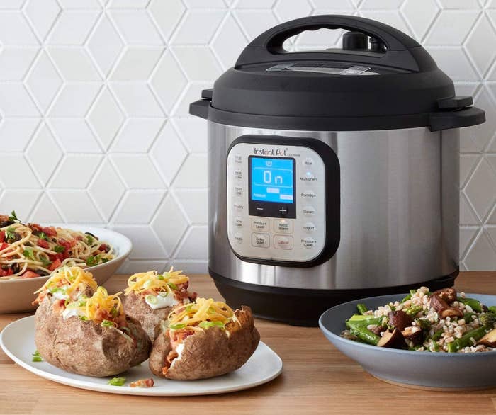 The Instant Pot beside yummy looking food