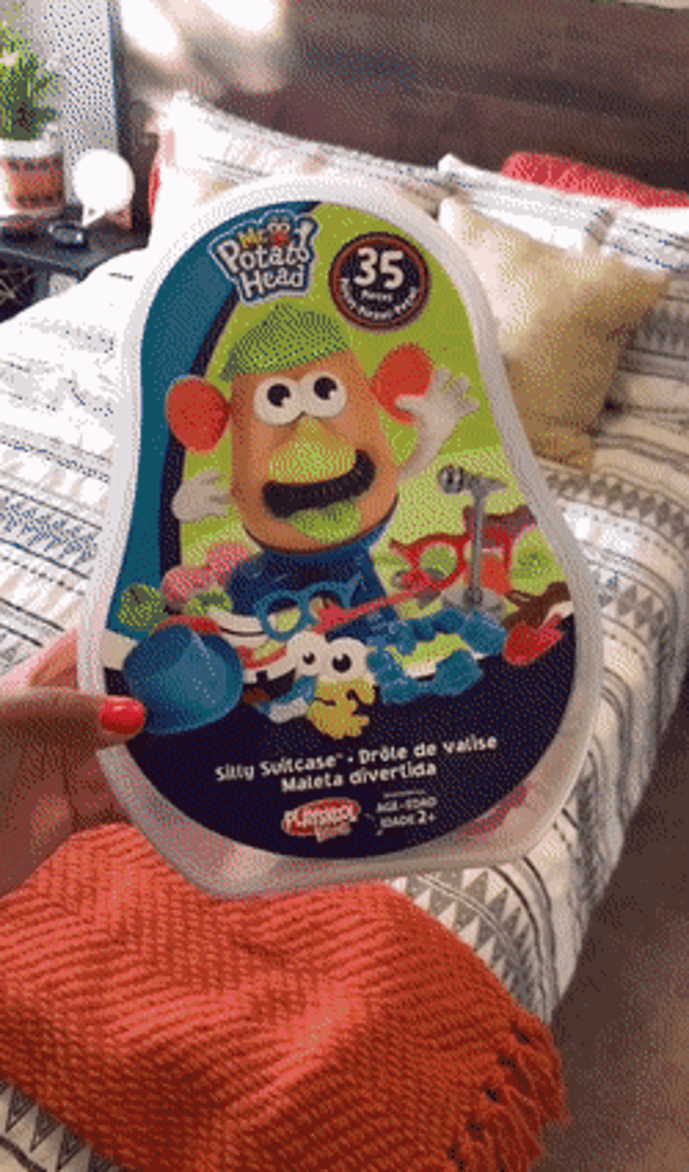 A gif of someone showing off Mr. Potato Head.