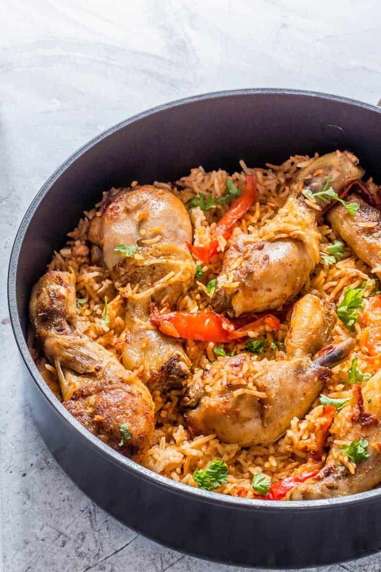 Baked jollof rice with peppers and chicken.