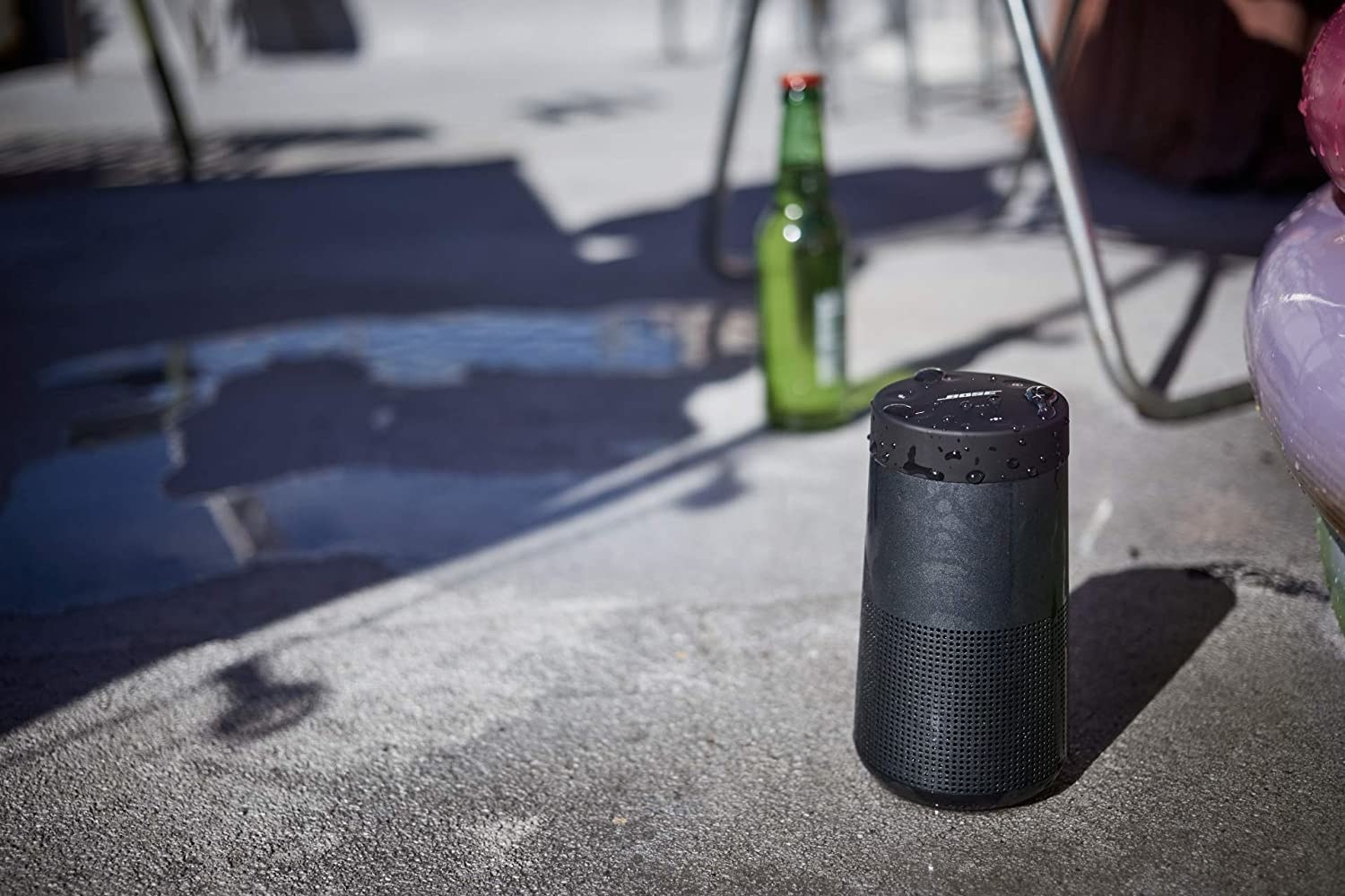 A small speaker next to a pool