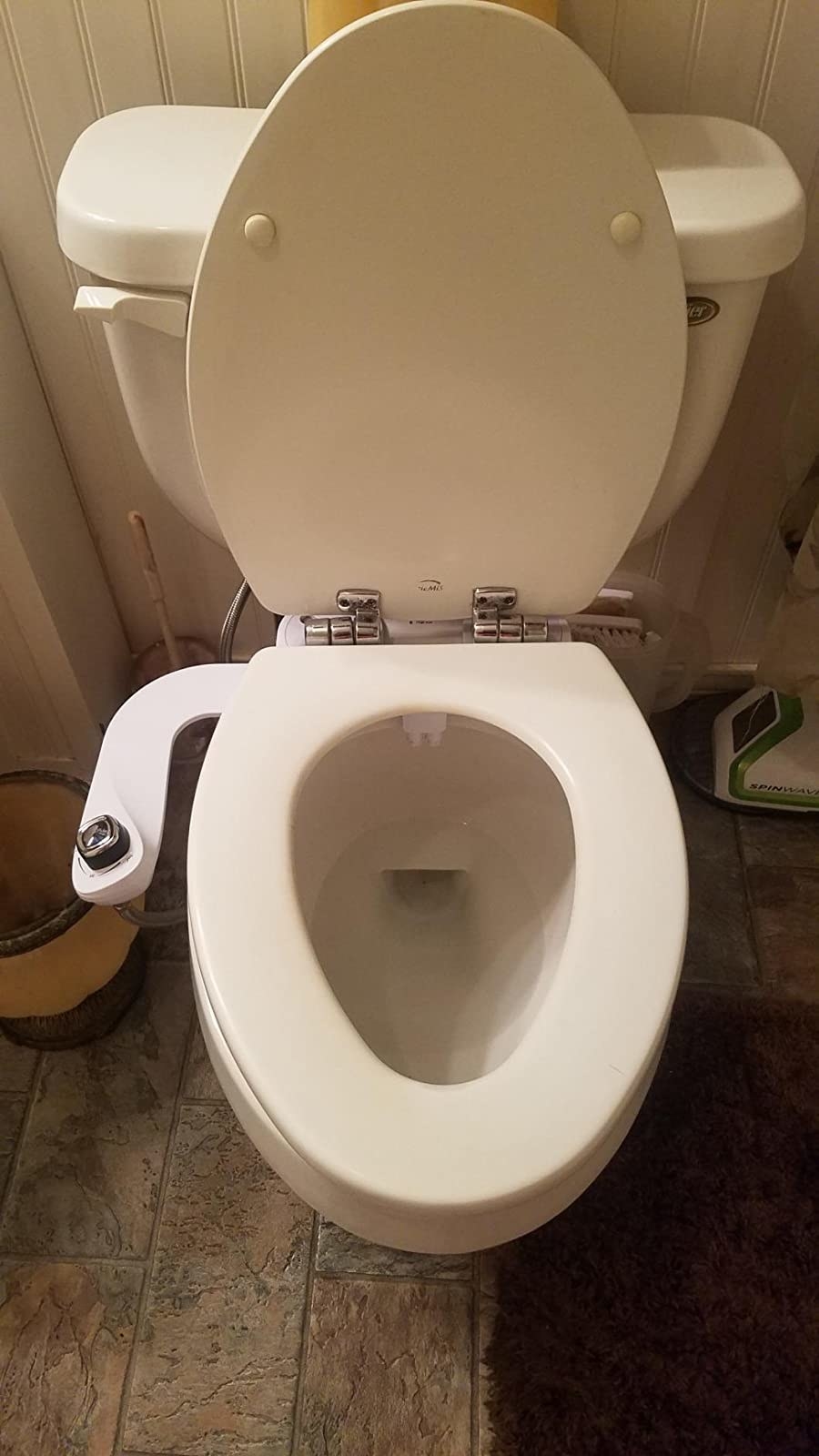 The bidet attached to a toilet