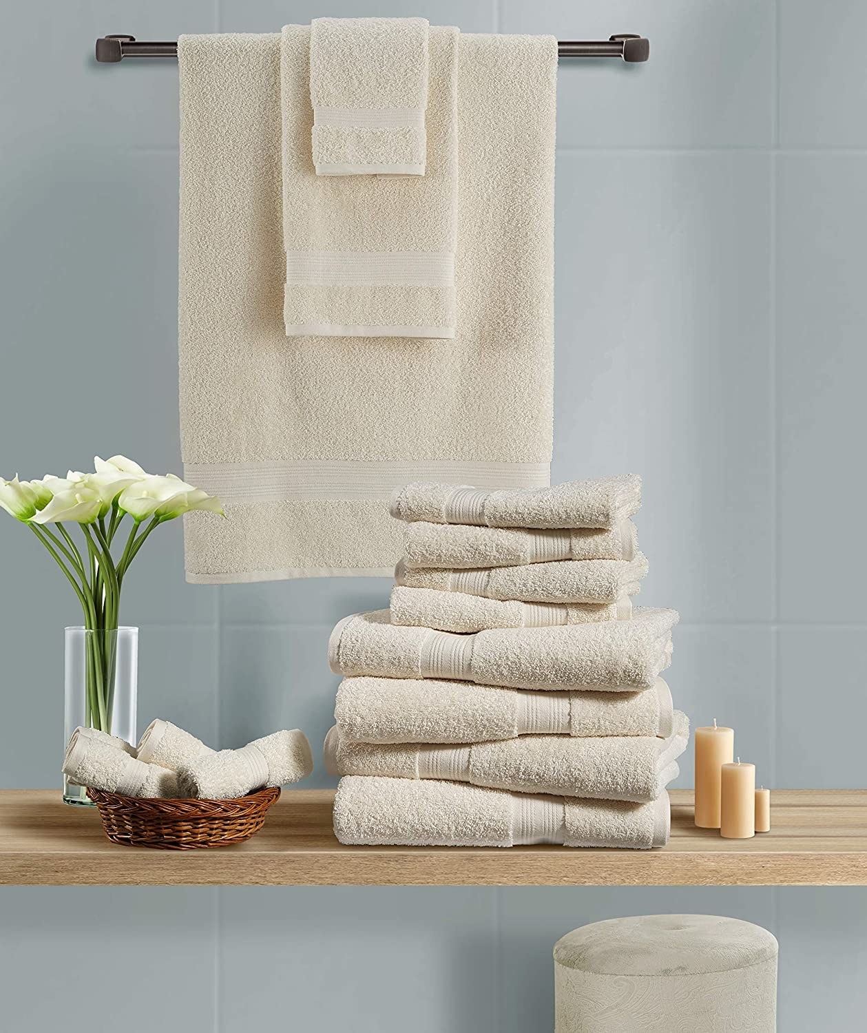8-piece towel set in ivory folded neatly in a bathroom 
