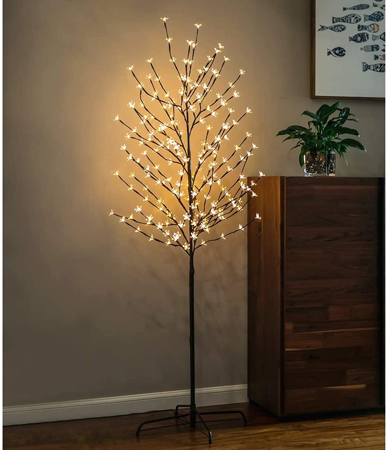 twinkle star cherry blossom light tree in a dimmed room 