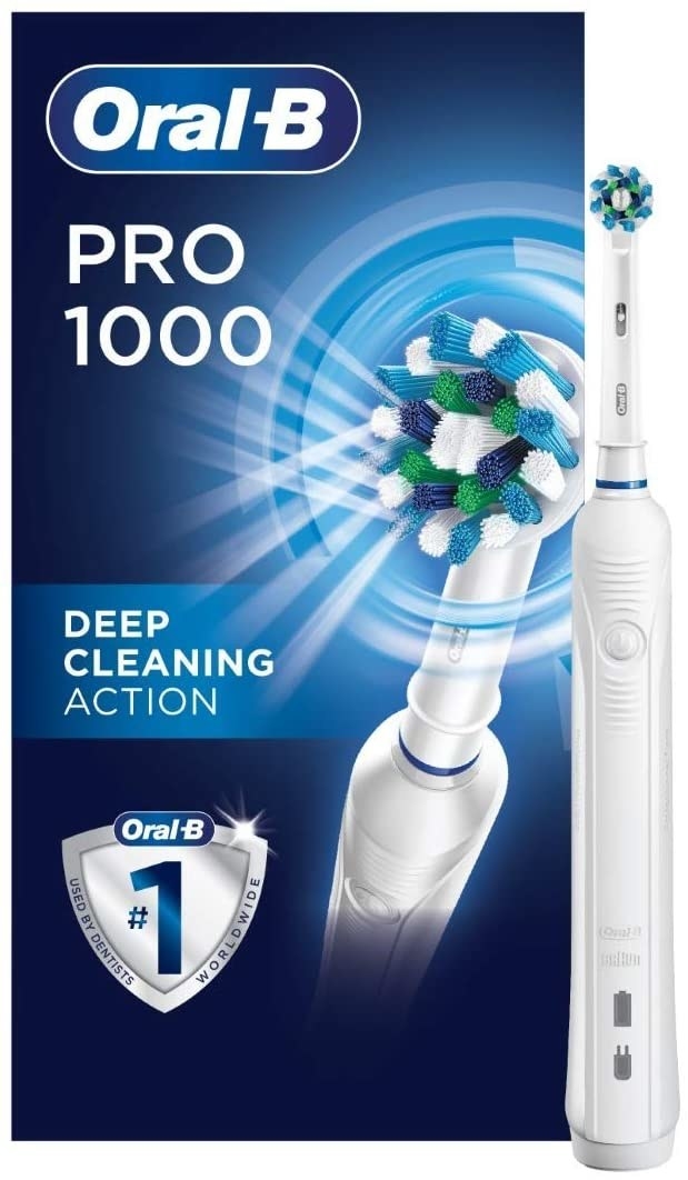 An electric toothbrush on a plain background