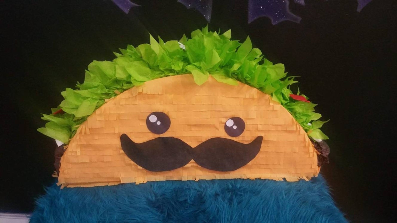 An image of a taco piñata. 