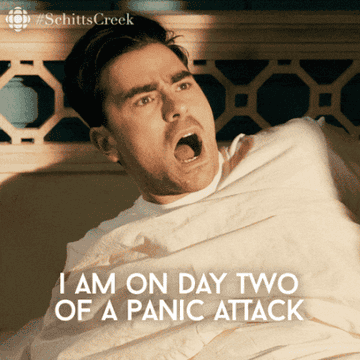 David sitting up in his bed while saying &quot;I am on day two of a panic attack&quot;