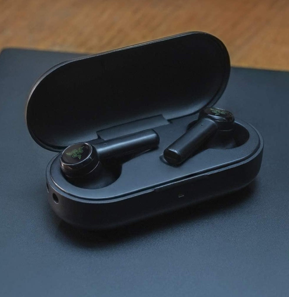 A pair of ear buds in their charging case