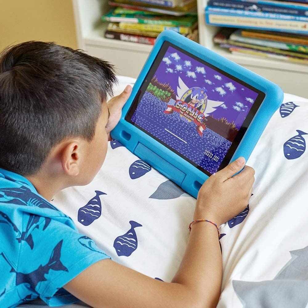 A child playing a video game on a Fire HD Kids Tablet