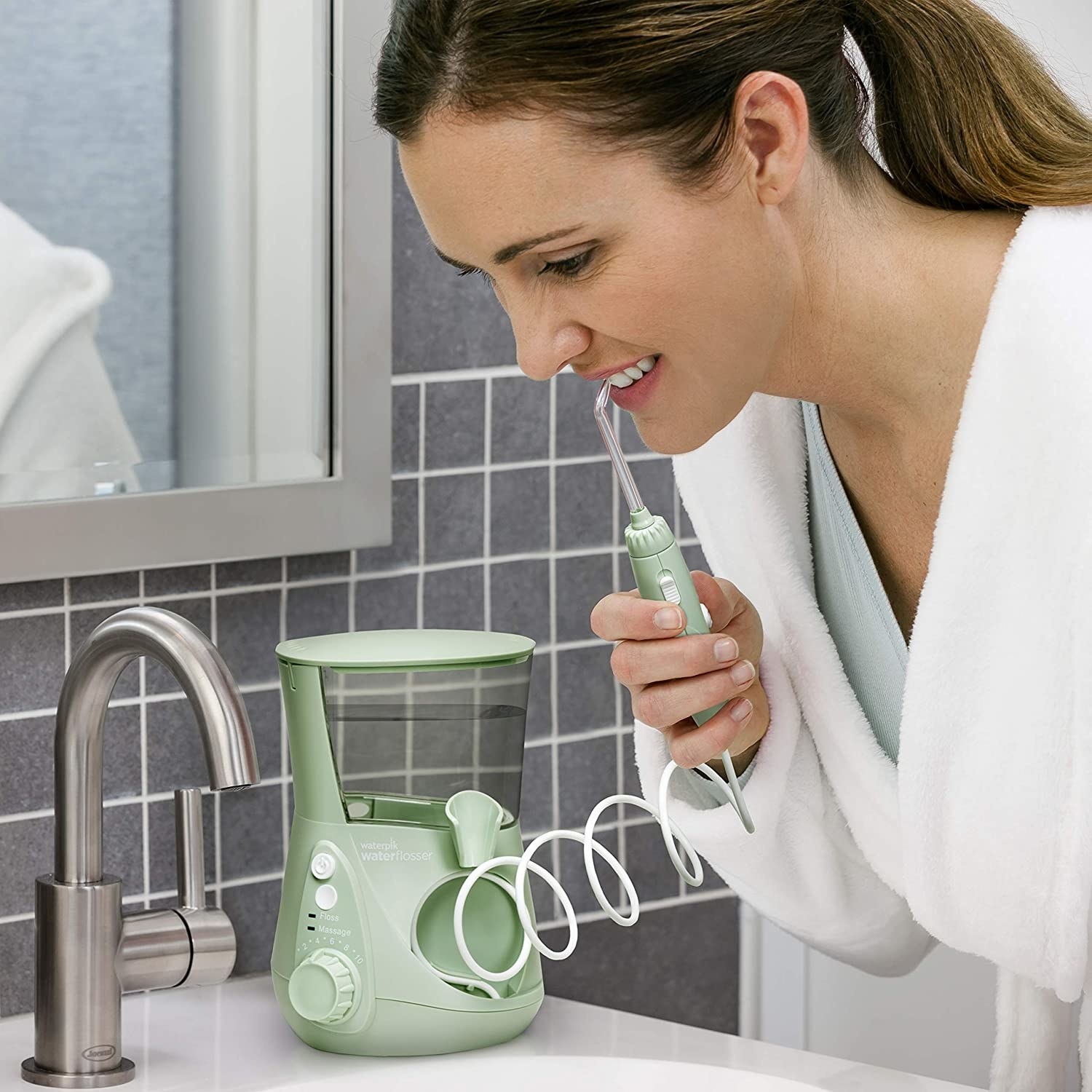 person using the waterpik