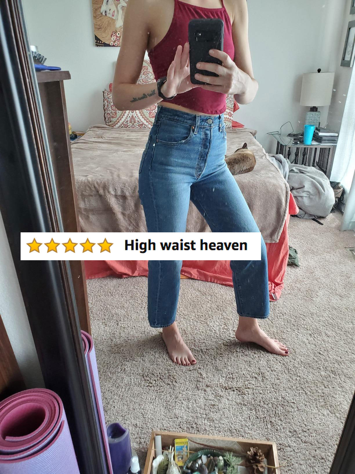 Reviewer in the jeans with five stars and text &#x27;High waist heaven&quot;