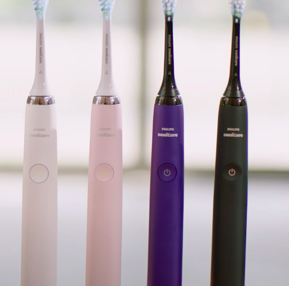 Four toothbrushes lined up