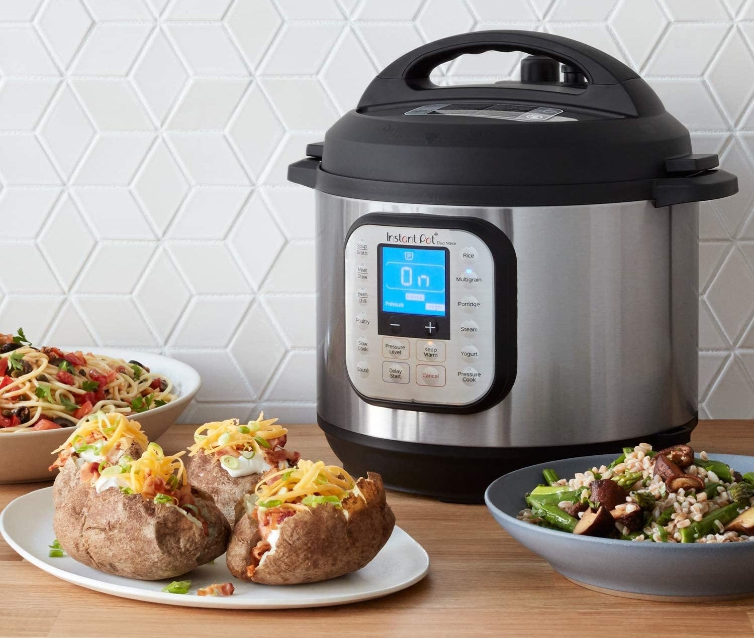 An Instant Pot on a kitchen counter beside yummy looking food