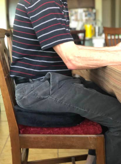 a person sitting on the cushion 