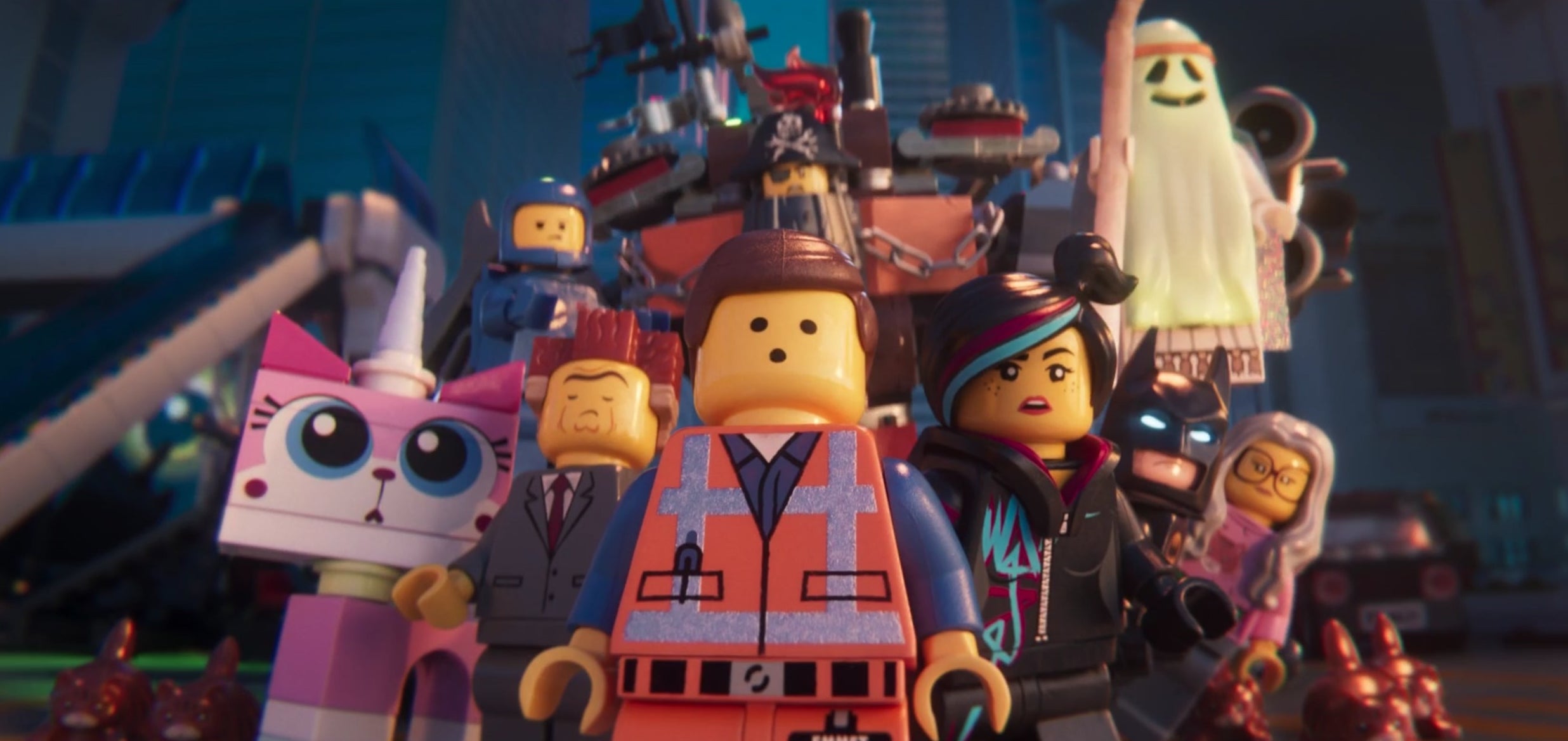 A group of LEGO characters looks at something offscreen