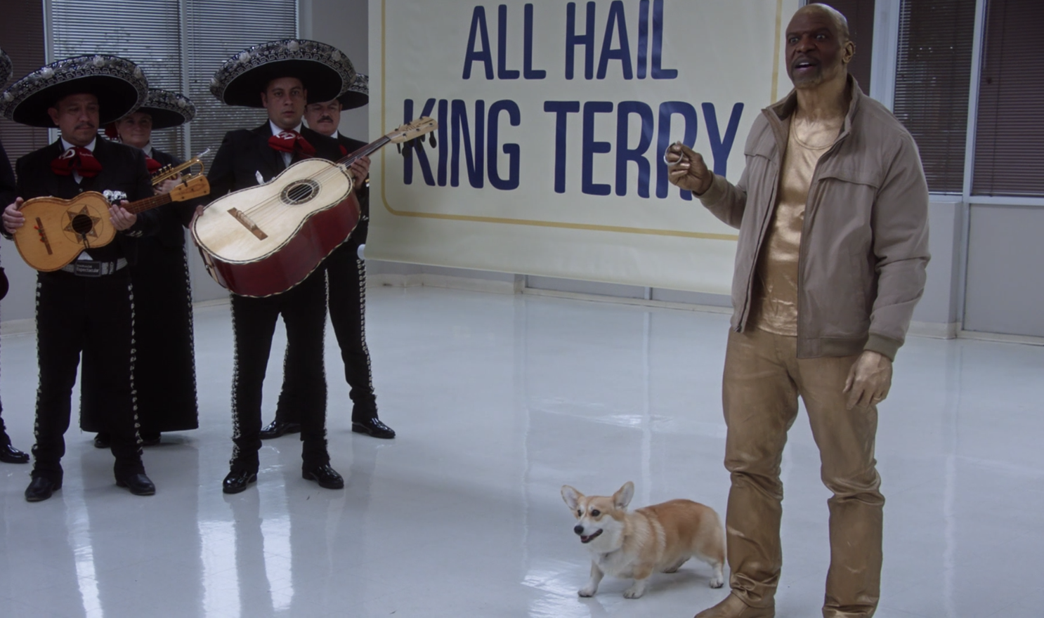 Terry painted gold standing next to Cheddar with a mariachi band