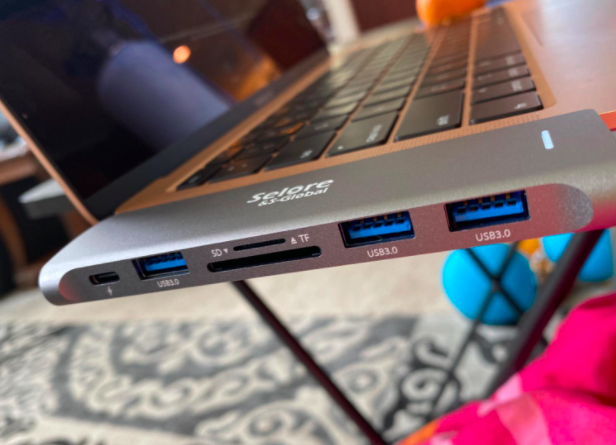 a slim adaptor with extra ports than comes with the mac 
