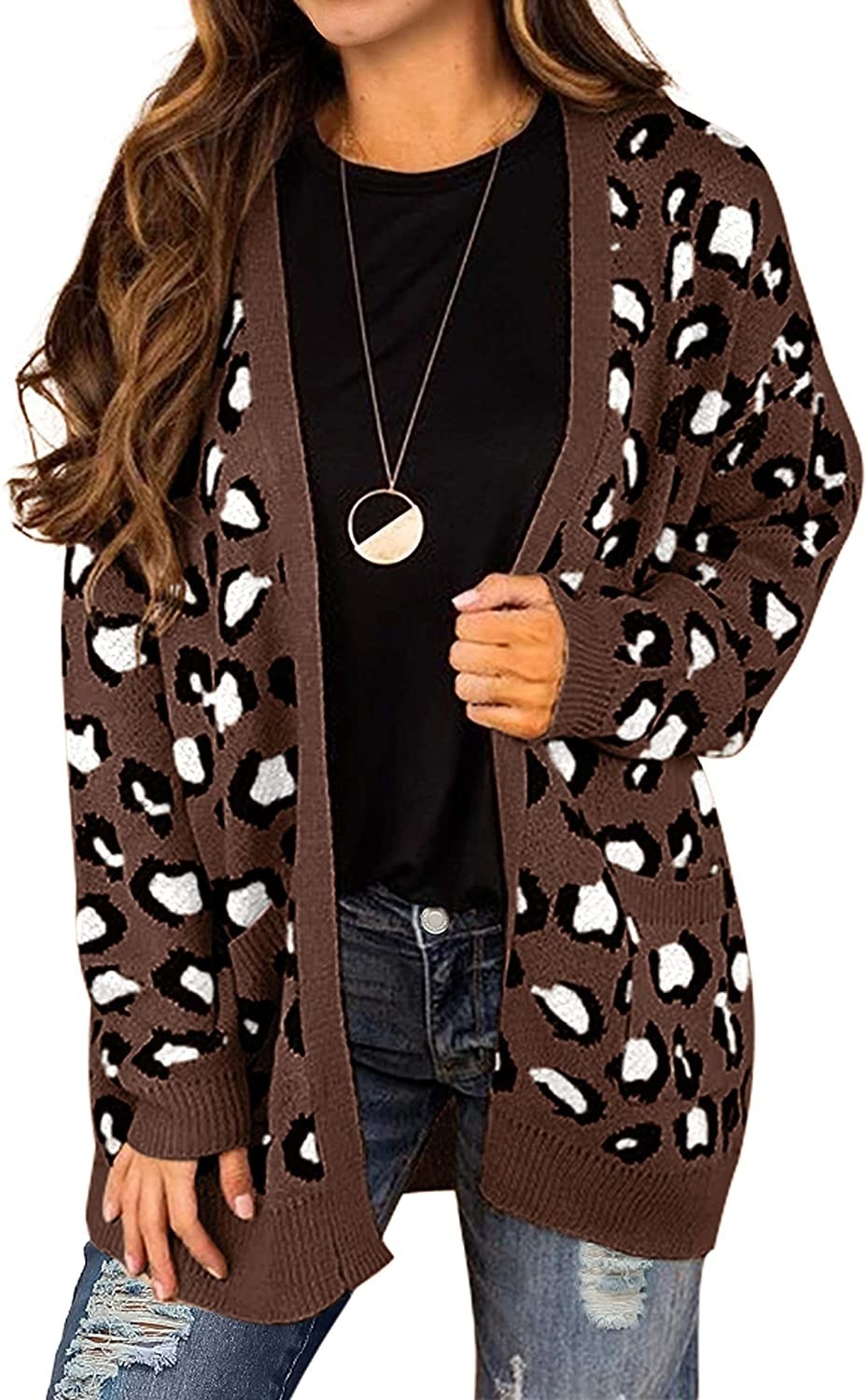 Model in the brown, black, and white leopard print sweater