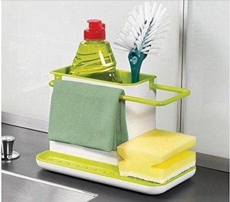A dishwashing gel, brush, napkin, and sponges neatly arranged in the organiser.