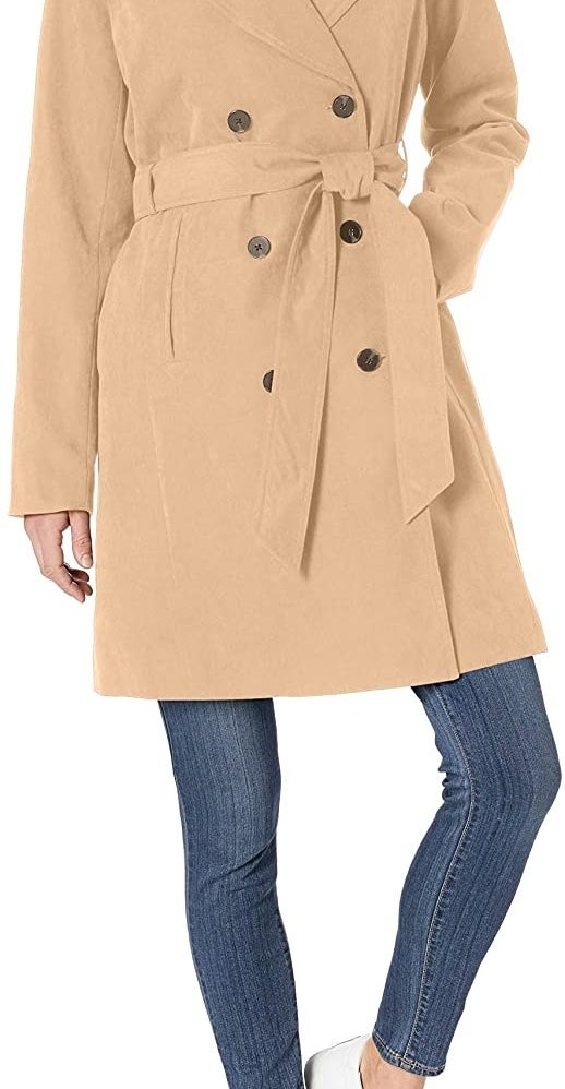 Model in the double-breasted camel trench coat