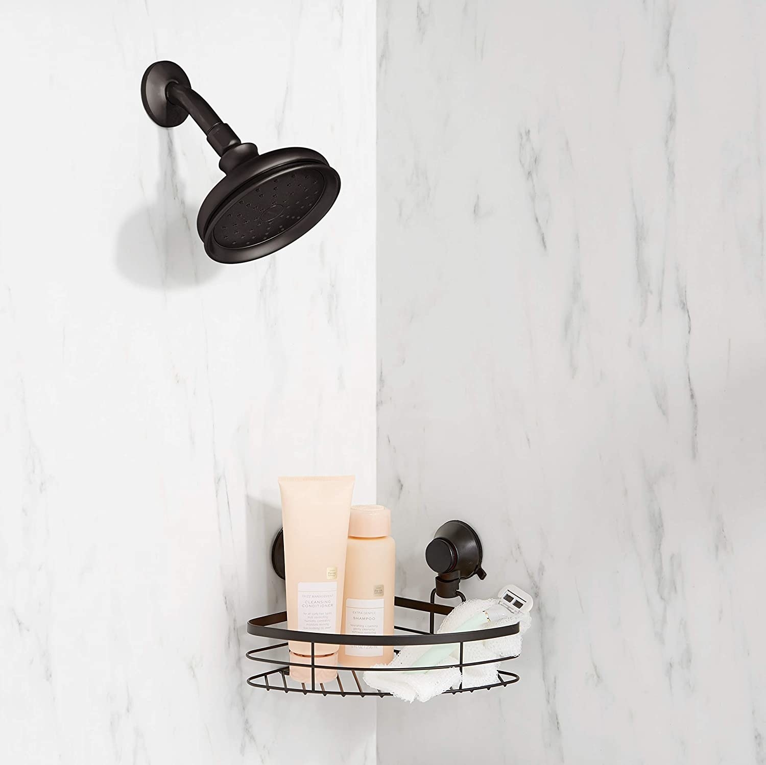 The shower caddy attached to the corner wall of a marble shower