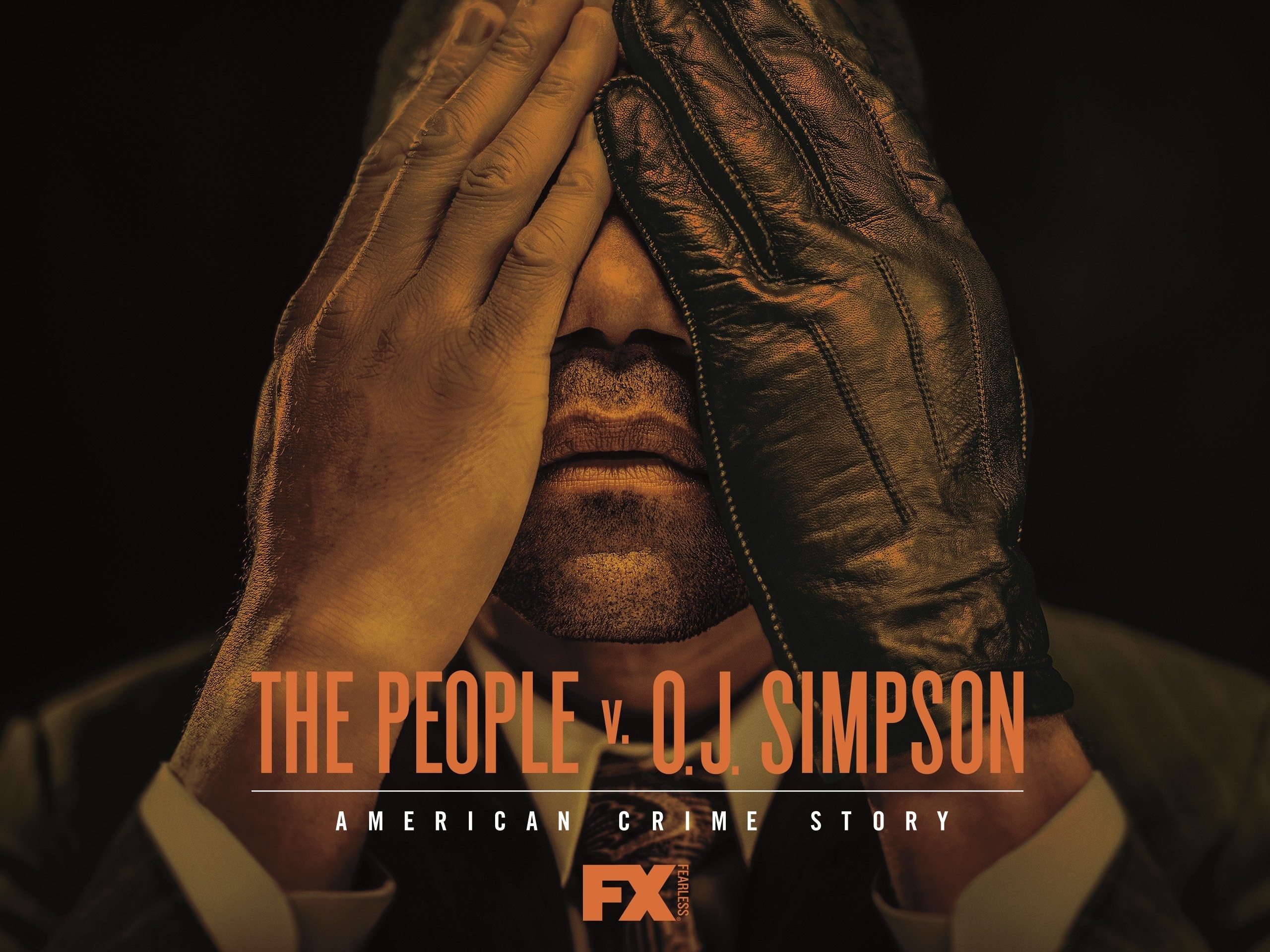 O.J. Simpson covering his face while wearing the infamous glove