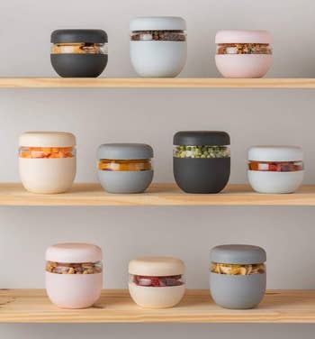 glass bowls with silicone wraps in different colors and sizes on a shelf