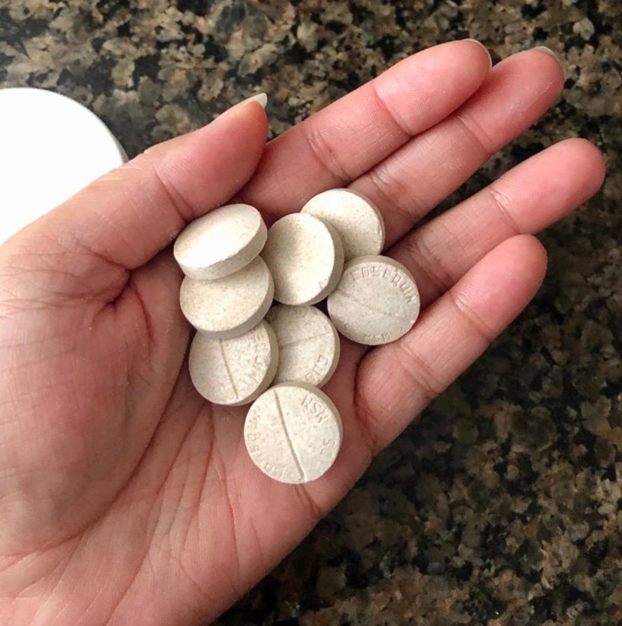 A reviewer&#x27;s image of the supplements in their hand