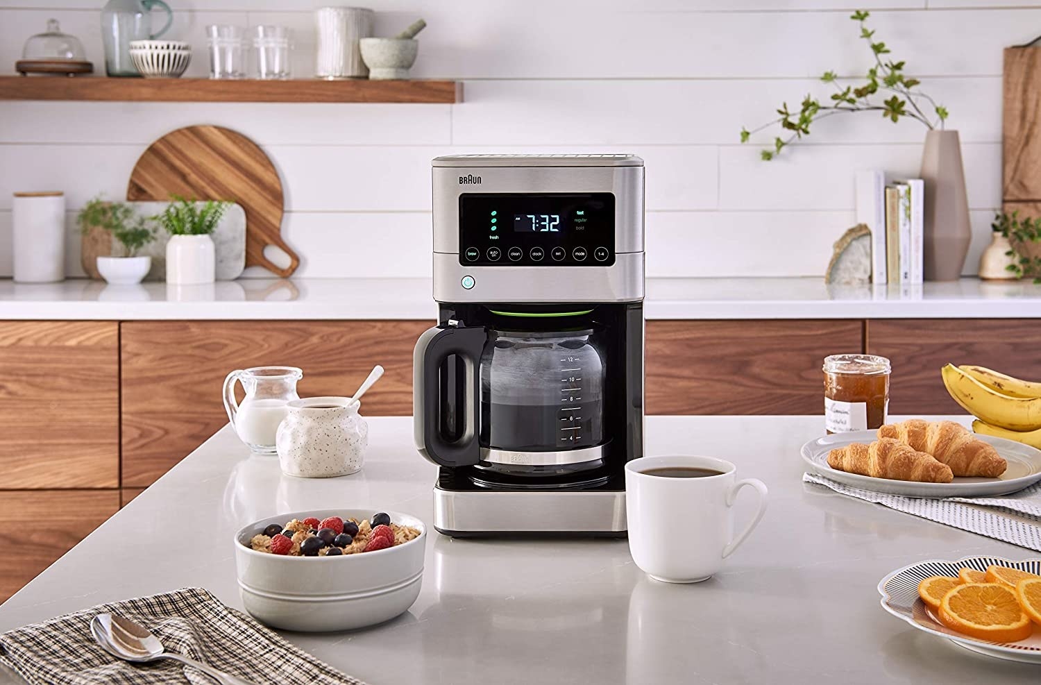 A coffee maker that's brewing coffee in a kitchen