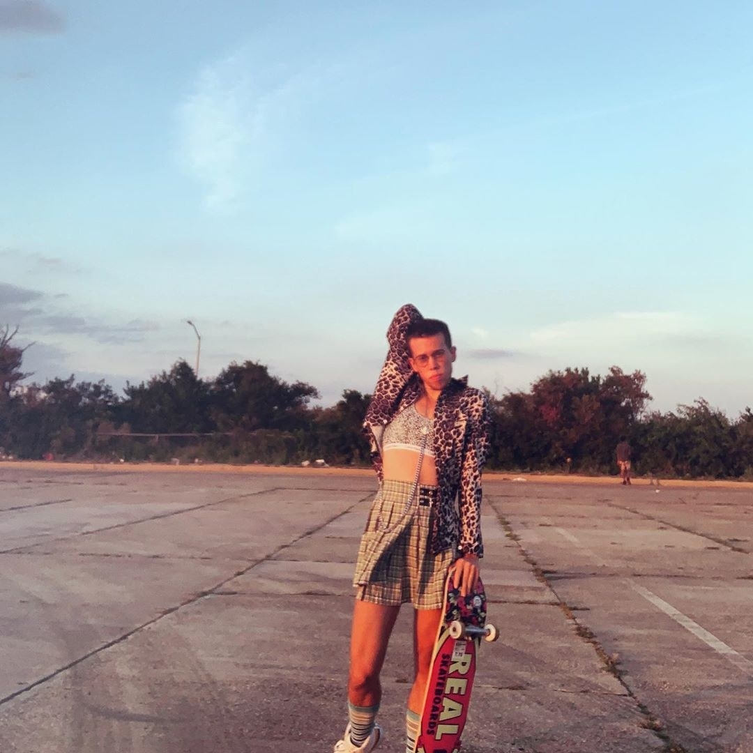 a photo of the author wearing the bralette layered under a long sleeve shirt 