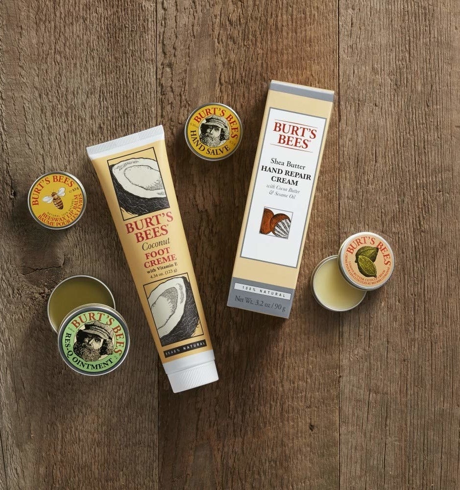 Burt&#x27;s Bees gift set products styled on a wood table 