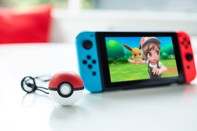 the pokemon ball next to a nintendo switch
