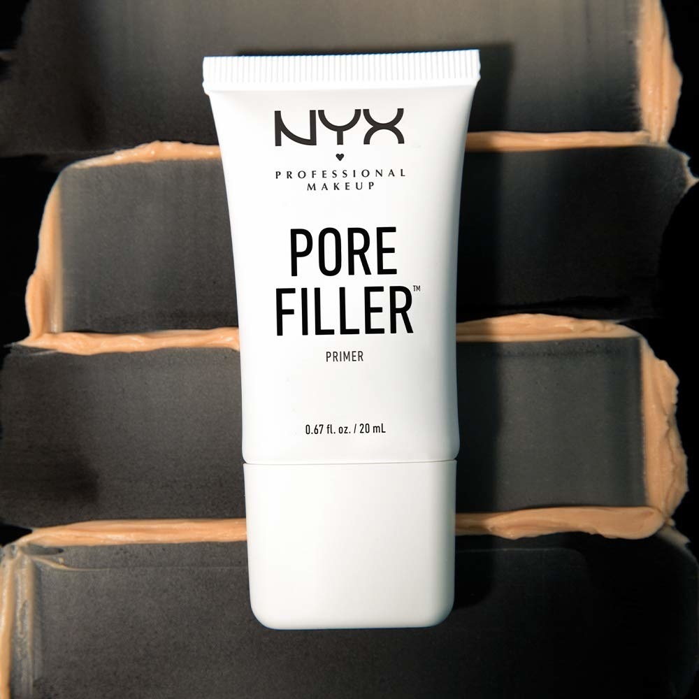 A tube of the pore filler on a background of smeared product