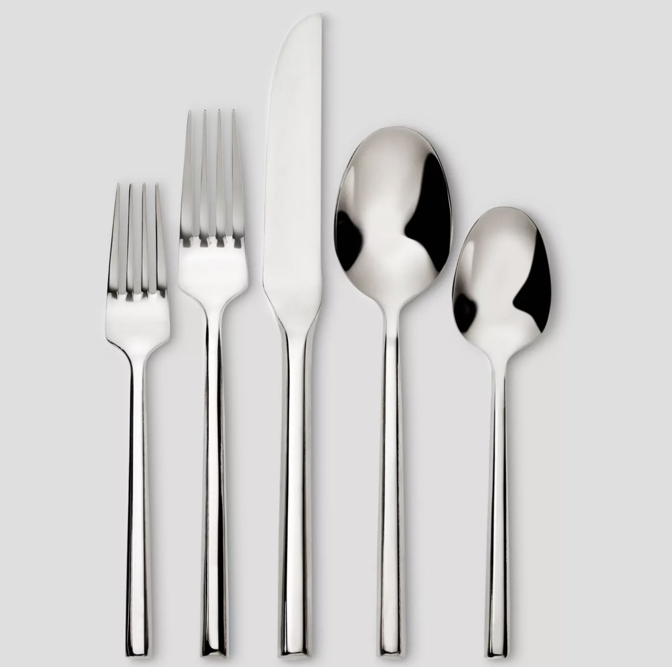 a salad fork, dinner fork, knife, tablespoon, and teaspoon