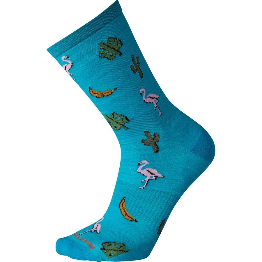 The teal sock printed with flamingos, bananas, leaves, and cacti