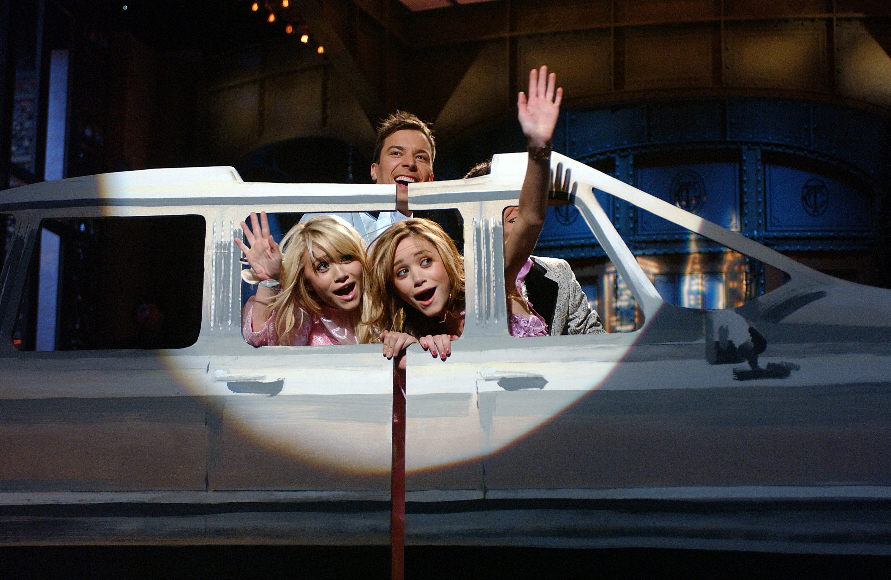 Mary-Kate and Ashley riding in a fake limo with Jimmy Fallon.