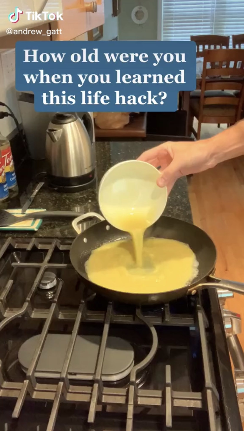 Screenshot of a TikTok showing eggs being poured into pan