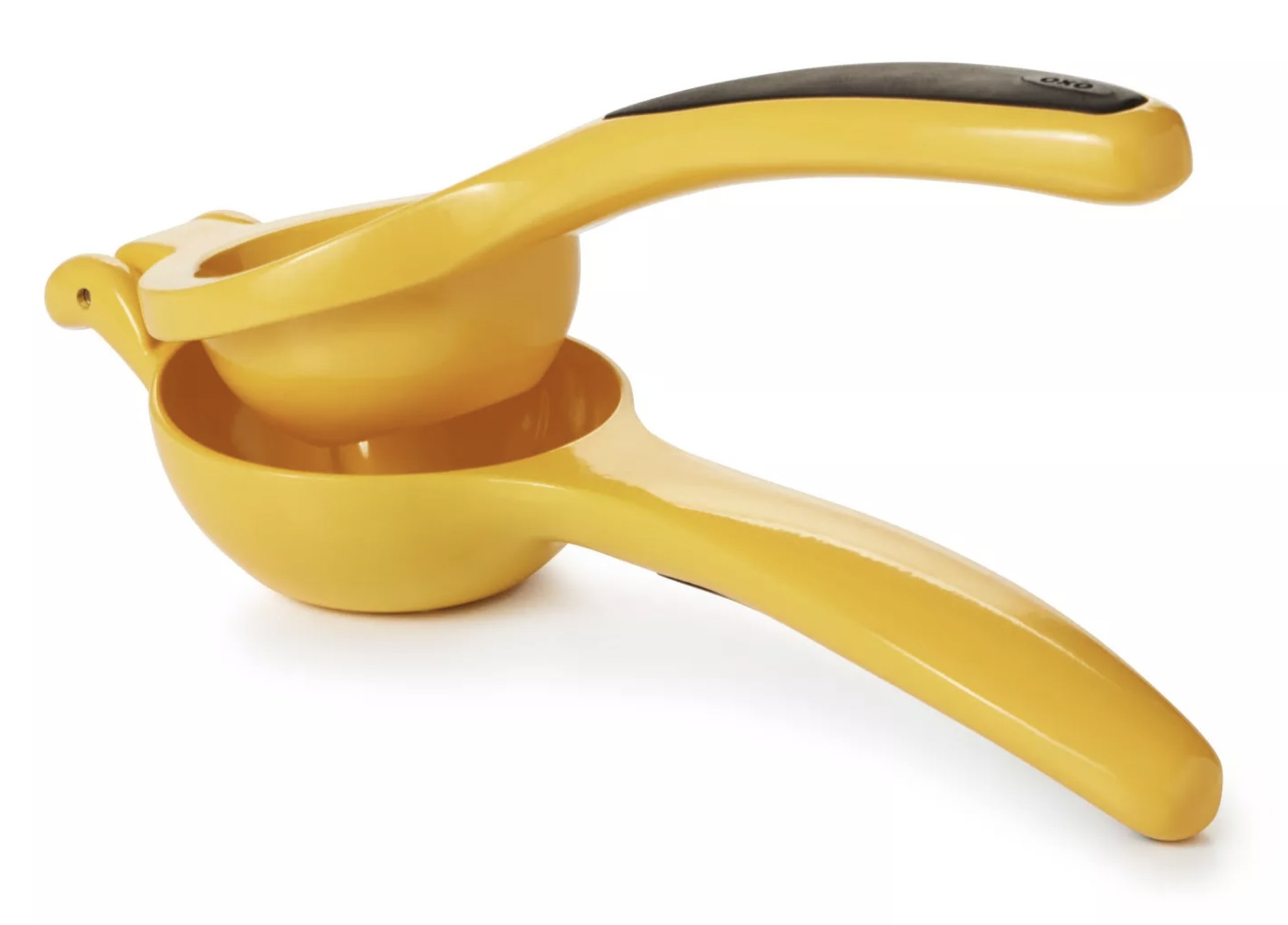 a yellow citrus squeezer with a black softgrip