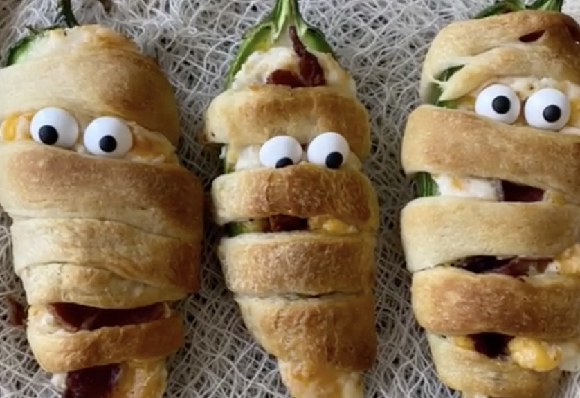 Jalapenos that are wrapped in dough to look like mummies 