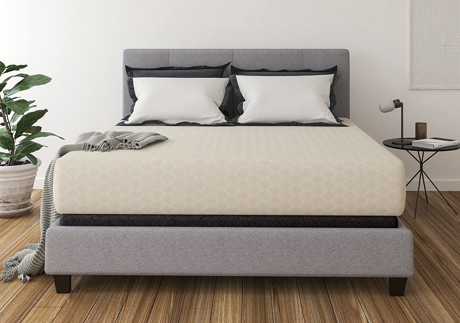 The mattress on top of a bed