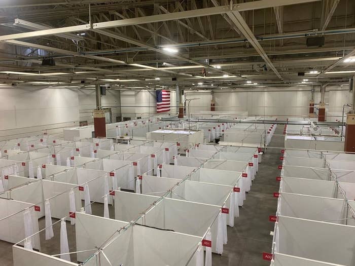 Photo showing rows of booths each intended to house a single COVID-19 patient