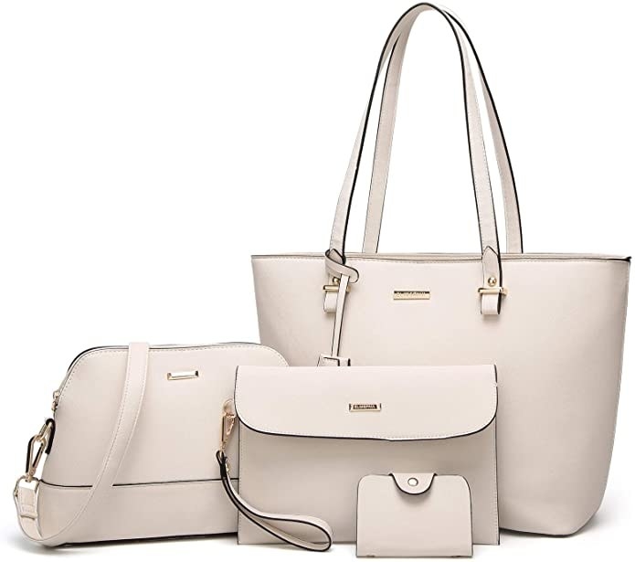 Four piece set in white with a tote, cross body, clutch, and wallet purse