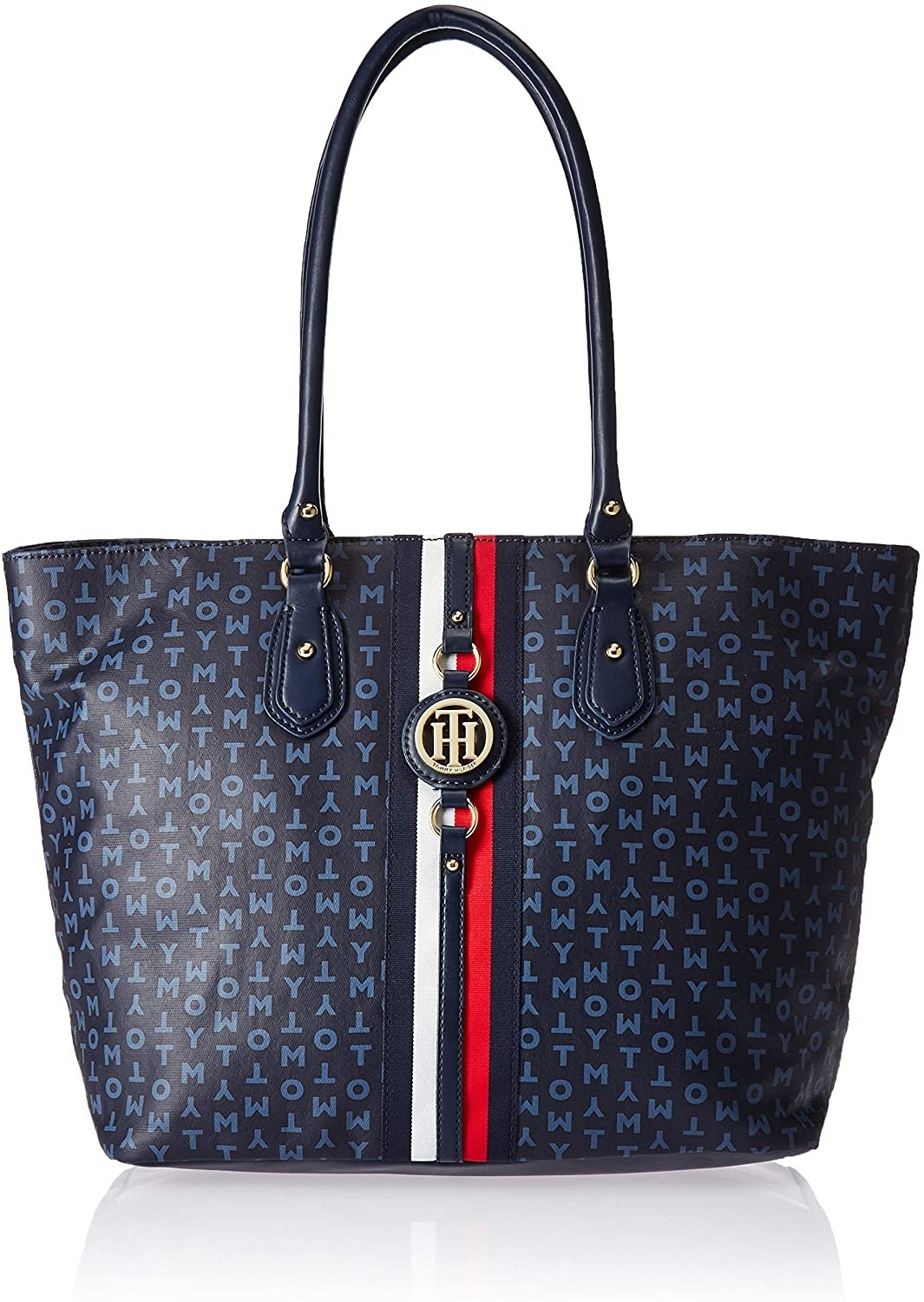 The navy blue tote bag with &quot;tommy&quot; letters printed all over it and a red and white stripe down the middle 