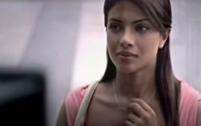 Priyanka chopra watches a commercial on television