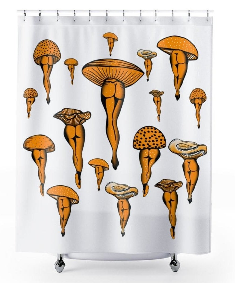 White shower curtain with orange mushrooms that have human legs (with bums out). All in different styles. 