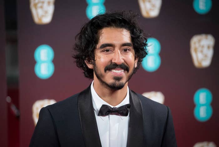 Dev Patel on the red carpet in a tux. 