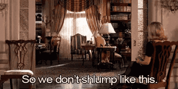 A gif of a man slumping through his living room.