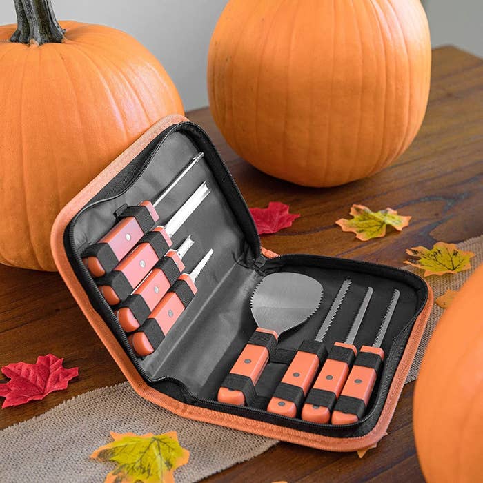 the tools with orange handles in a black and orange carrying case