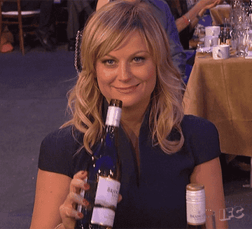 Amy Poehler drinking wine straight from the bottle.